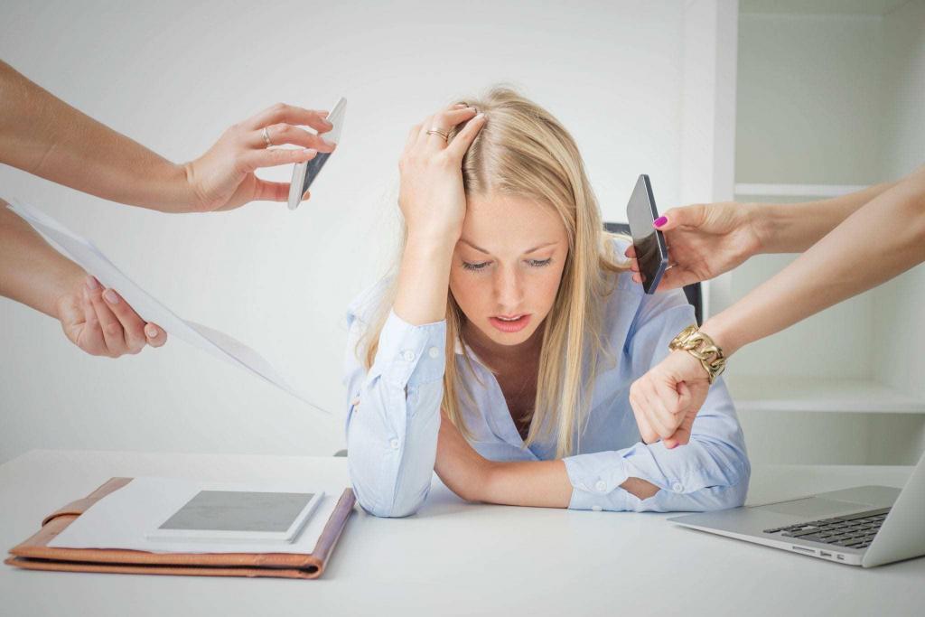 Woman with her head in her hands at work feeling stressed 7 ways to master stress, e-Surgery