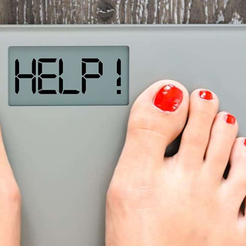 Woman with painted toe nails standing on scales that read 'Help!', things you need to know about obesity, e-Surgery