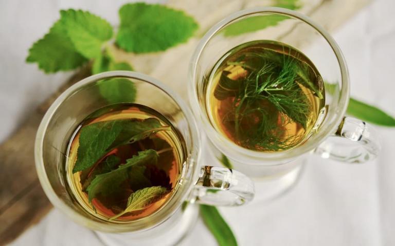 Two glass mugs filled with green tea, green tea extract can help to burn fat, e-Surgery