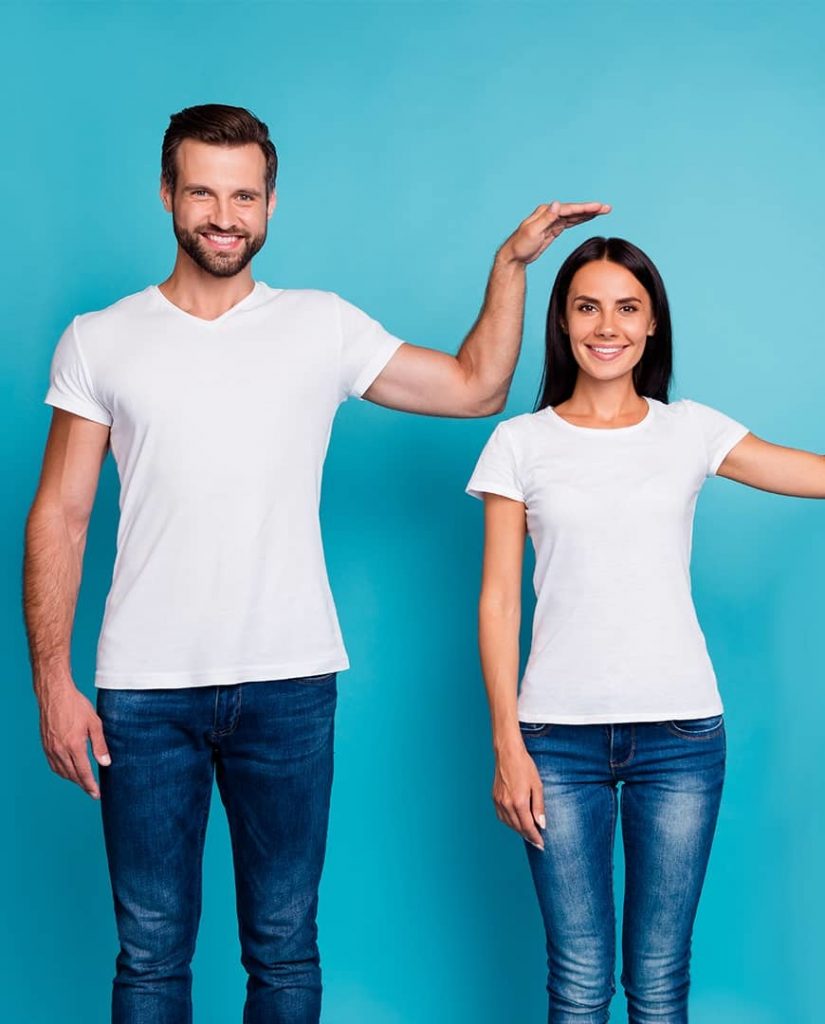 Short woman and tall man in white top and blue jeans, being tall is good for your health, e-Surgery