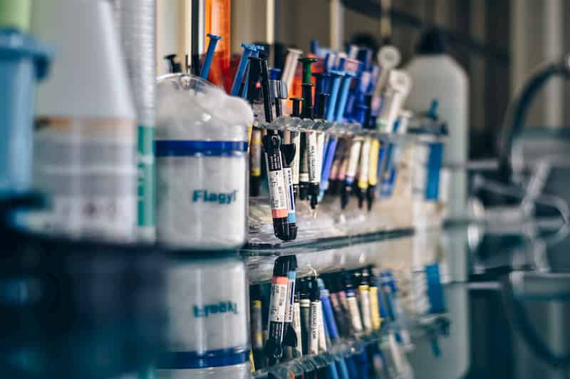 Science lab desk with scientific equipment, the dangers of expired medication, e-Surgery