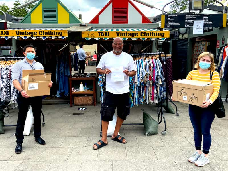 e-Surgery CEO's handing out hand sanitiser for free in Norwich Market, Taxi Vintage Clothing shop in Norwich market