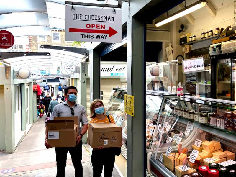 e-Surgery CEO's handing out hand sanitiser for free in Norwich Market, The Cheeseman shop in Norwich market