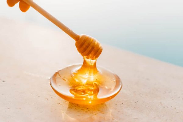 Bowl of honey for acne home treatment