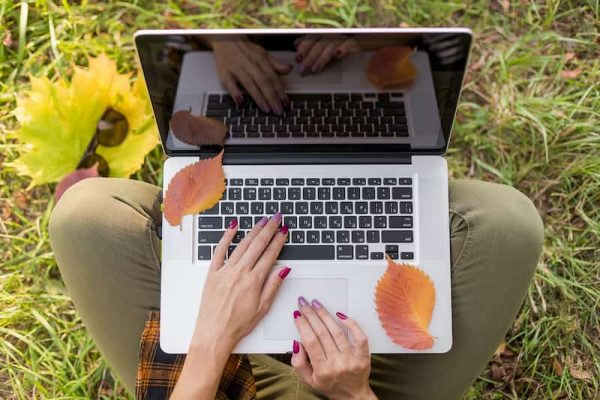 Person using laptop outside