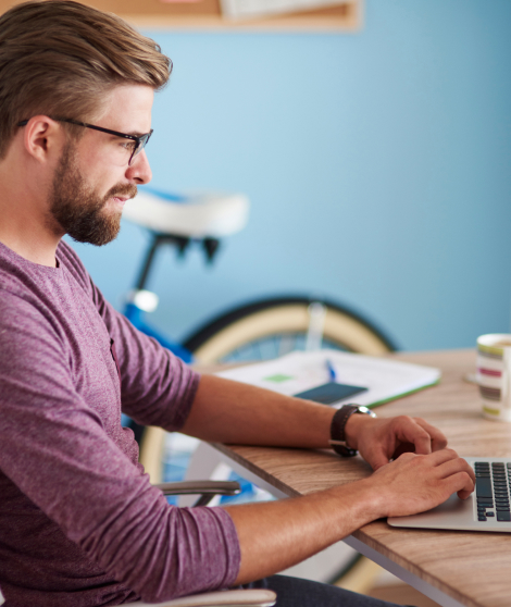 Young man completing consultation for treatment online | How it works | e-Surgery