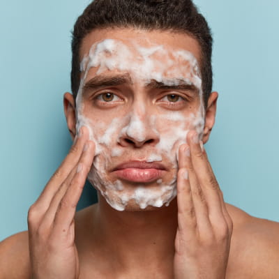 man using medicine for acne wondering Home remedies for acne scars |e-surgery