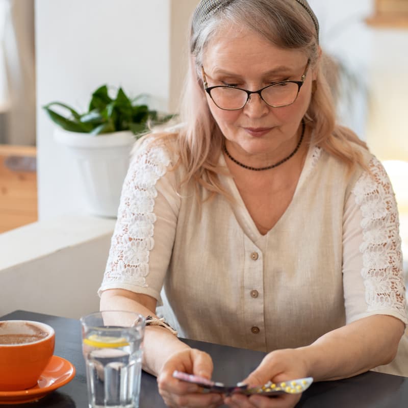 Middle aged woman looking at HRT treatments