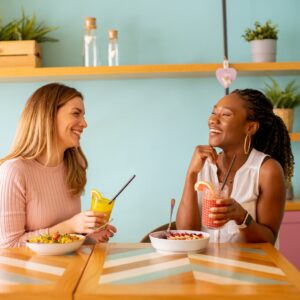 Two friends talking and eating healthy weight loss food