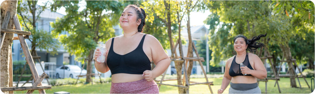 two woman jogging in a park