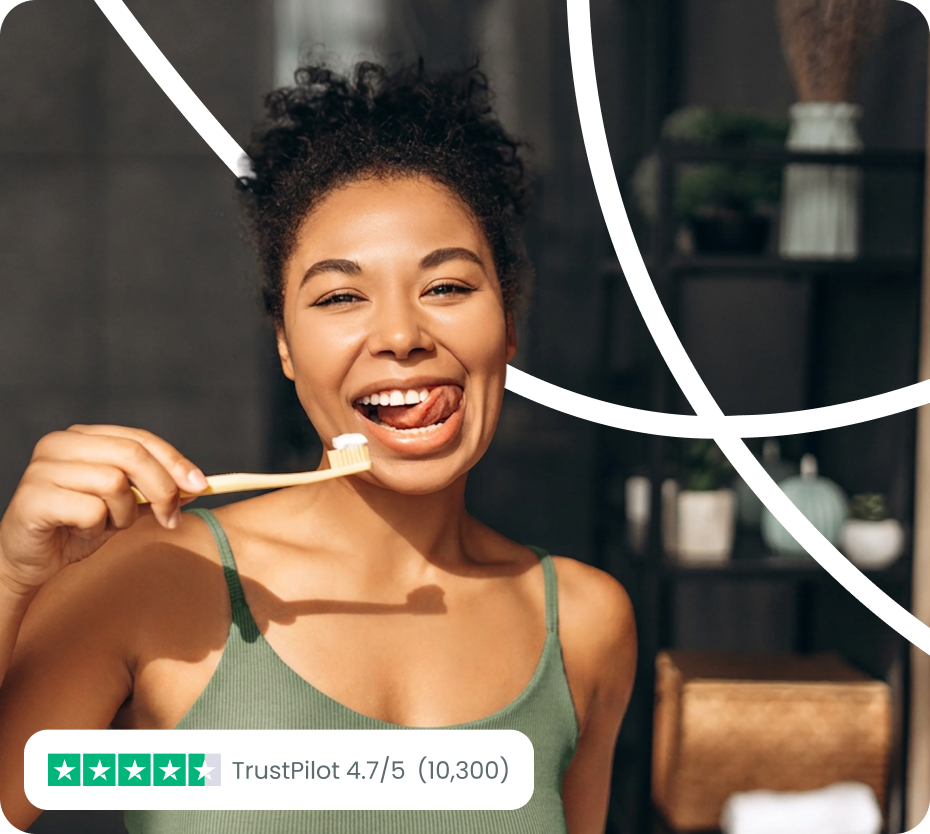Woman holding a tooth brush and smiling