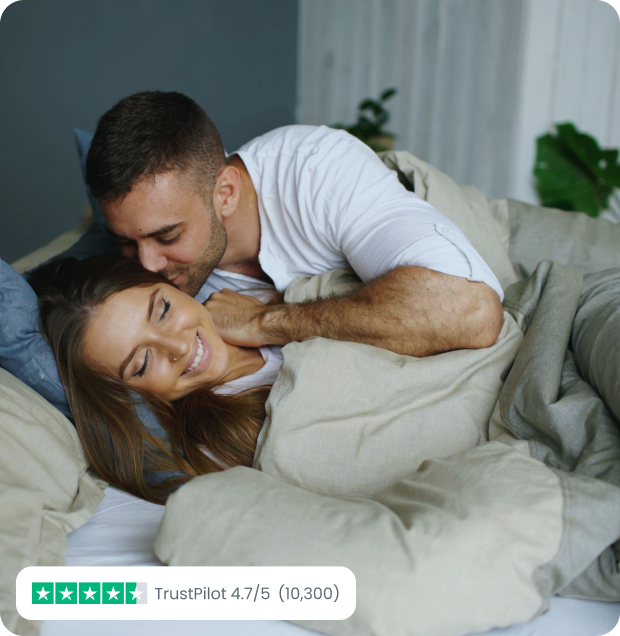 Happy couple laying in bed